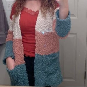 Super cute multi color cardigan- fits more like a medium